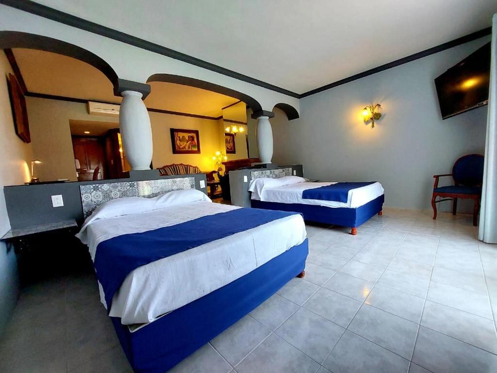 Hotel room with two beds and arched interior
