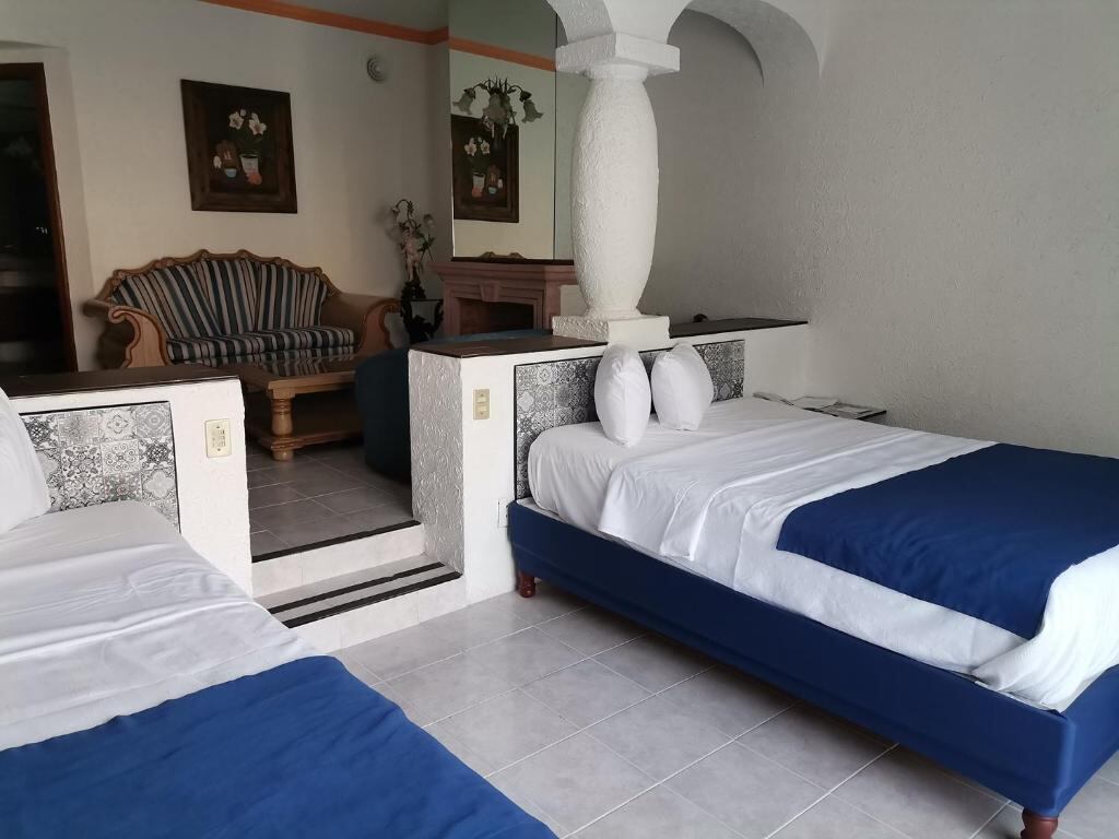 Room with seating area and colonial column